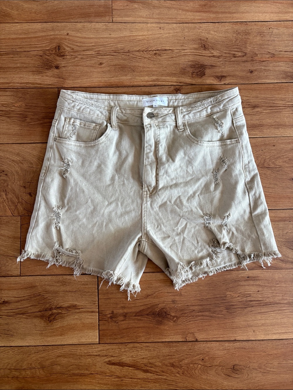 High-Rise Distressed Jean Shorts in Light Beige
